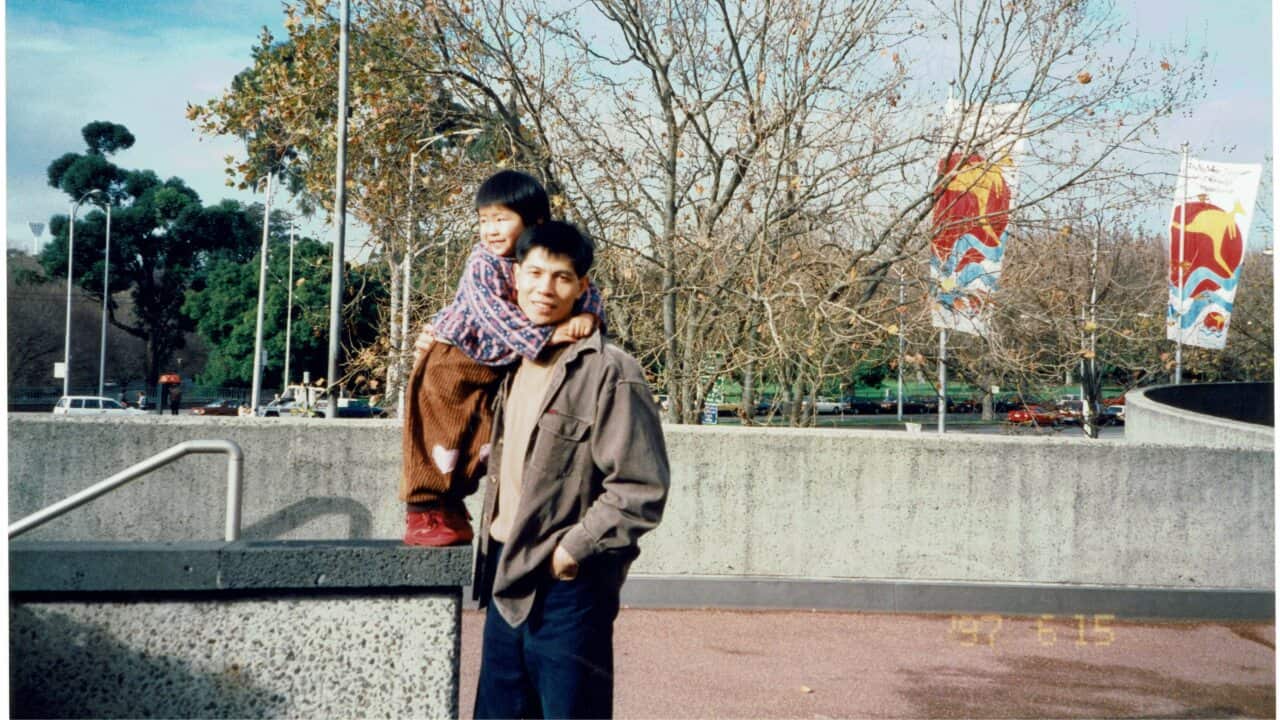 Ting Huang as a child with their father.