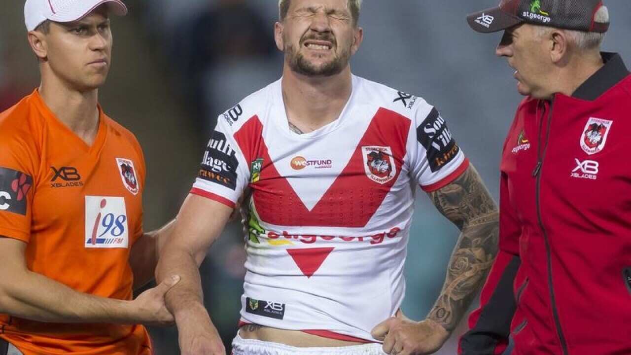 Gareth Widdop of the Dragons is injured during Round 22.