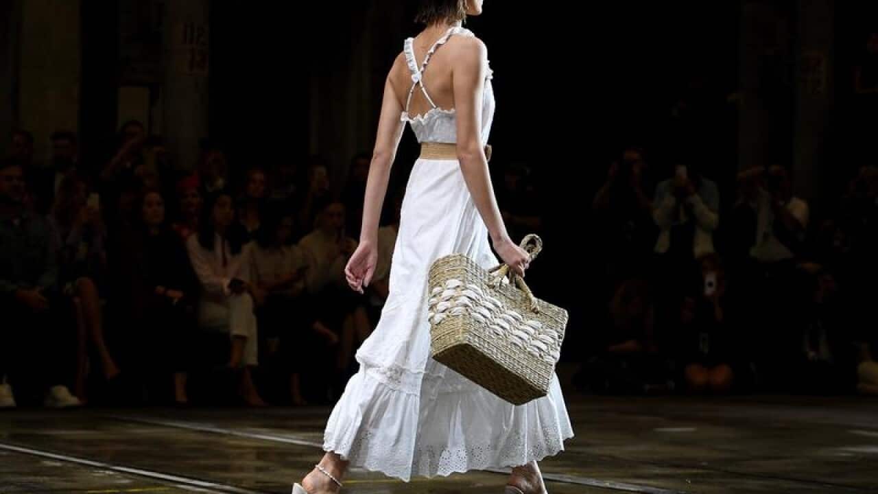 A model walks the runway wearing Tigerlily at Fashion Week