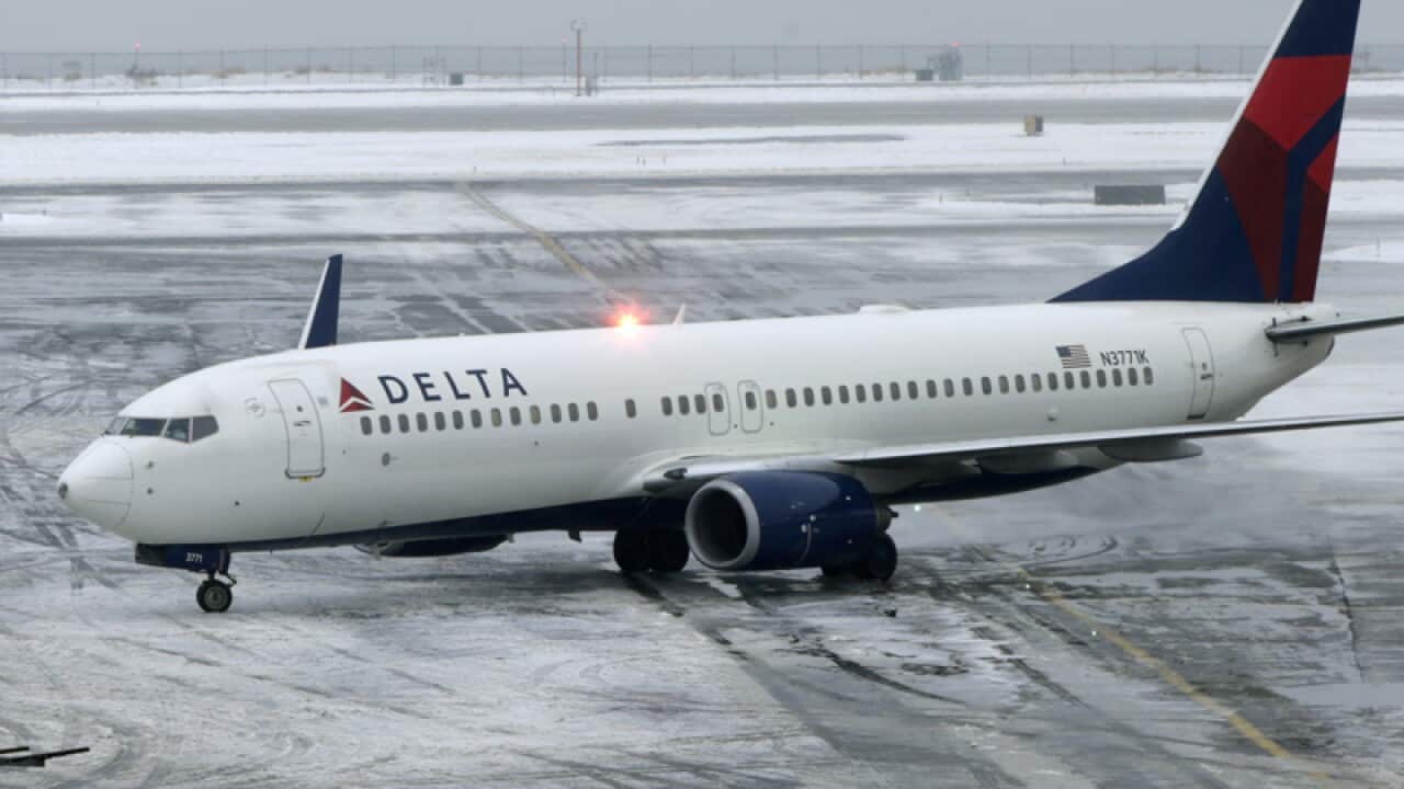 Plane skids into snow bank at JFK