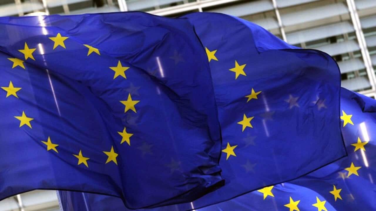 Flags of the EU, European Union infront of the building of the European Commission in Brussels, Belgium