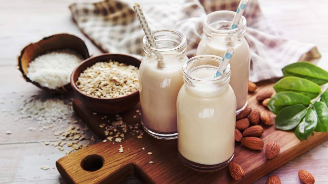 Alternative types of vegan milks in glass bottles,Romania