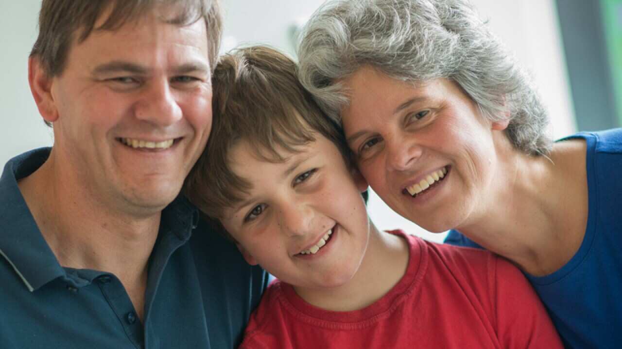 Luke Shambrook (centre) and his parents