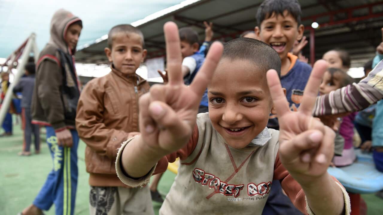 Iraqi refugee children playing inside a medical centre at Hammam Aleel refugee camp north of Iraq in April 2017.