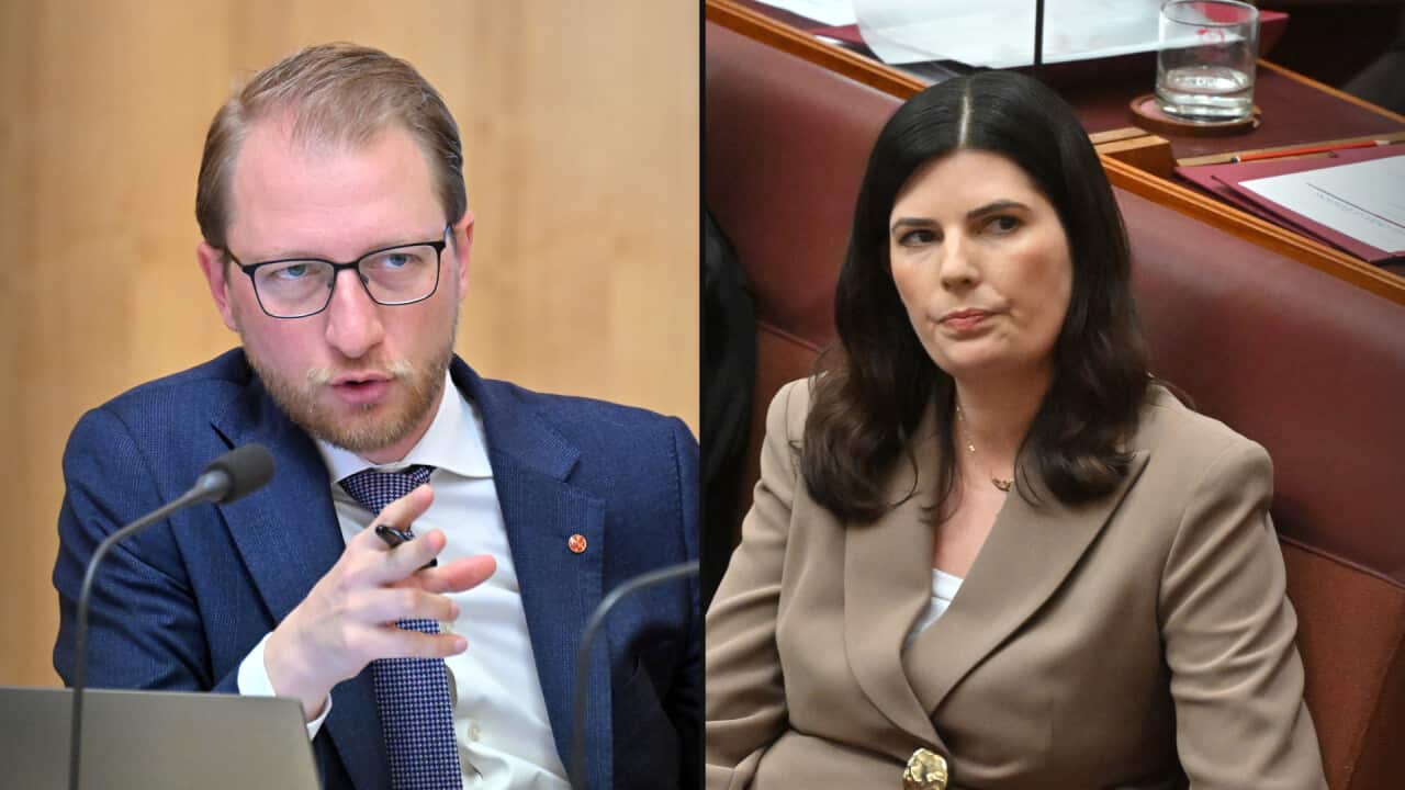 A split image, on the left a man in a navy suit and glasses points as he speaks. The woman on the right, in a light brown suit, glances to the side pursing her lips.
