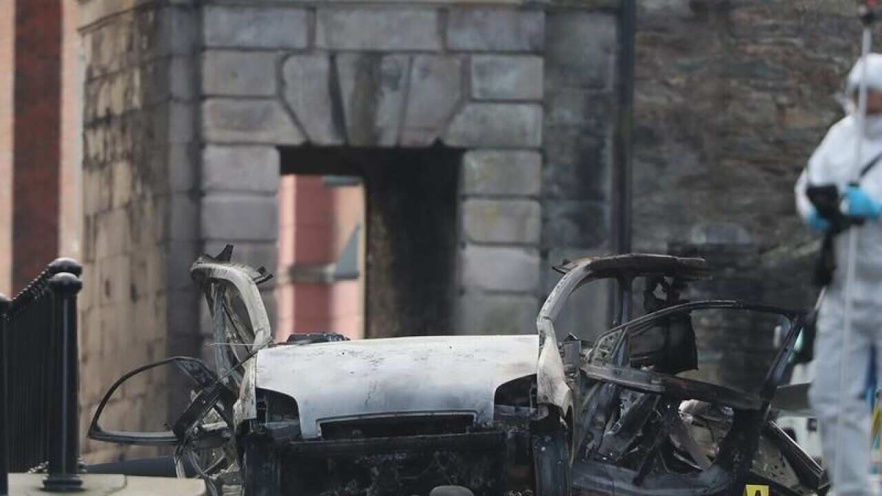 Remains of the bomb and van are examined