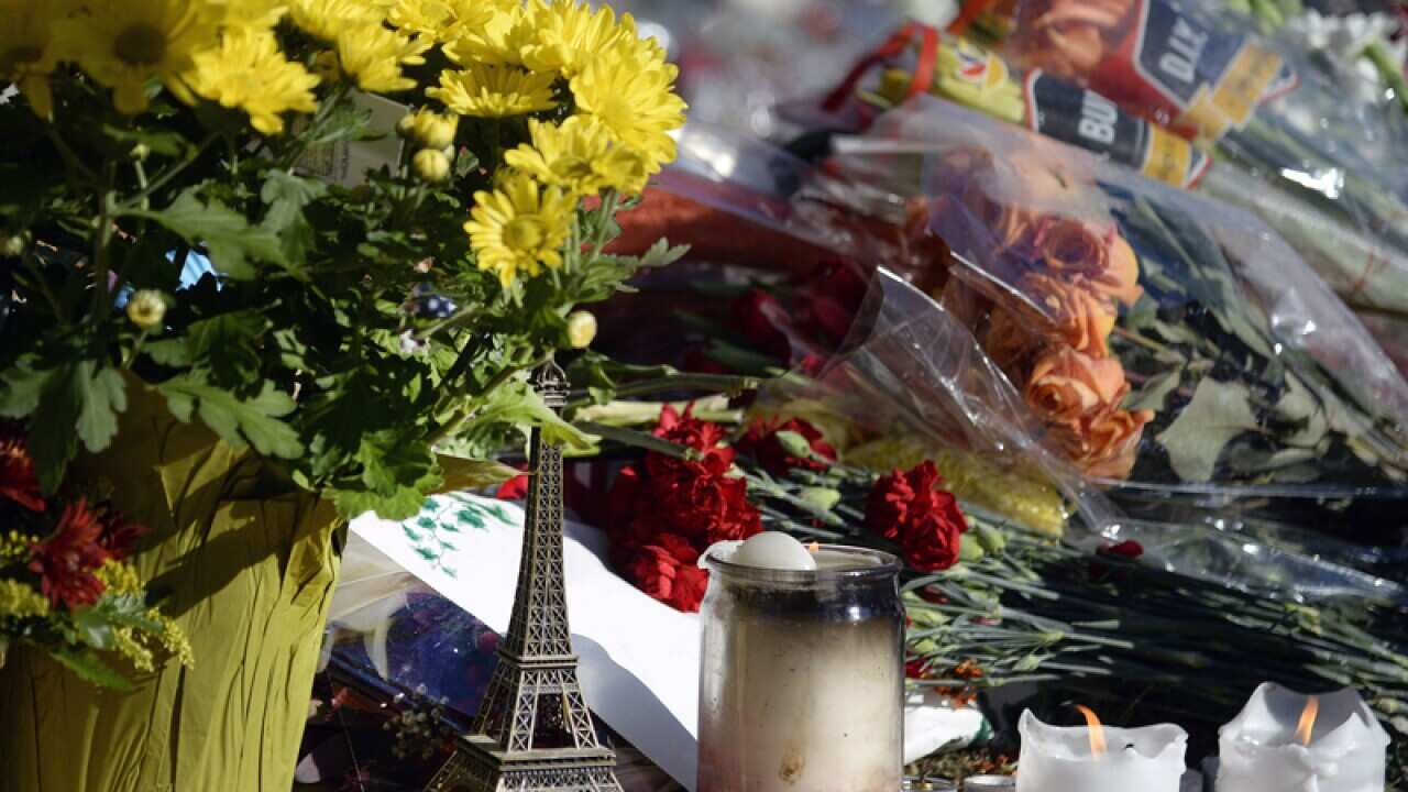 Signs and messages of support gave been left at a memorial for victims