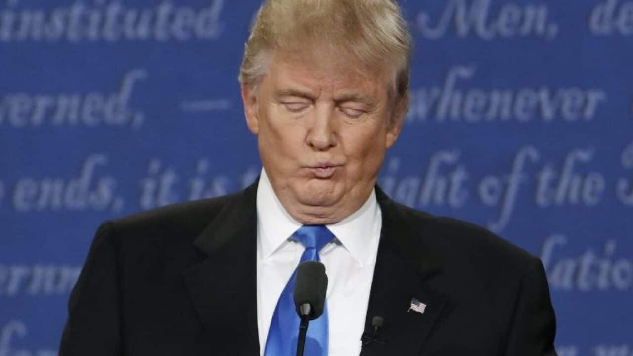 Republican U.S. presidential nominee Donald Trump reacts during the first presidential debate with Democratic U.S. presidential nominee Hillary Clinton.