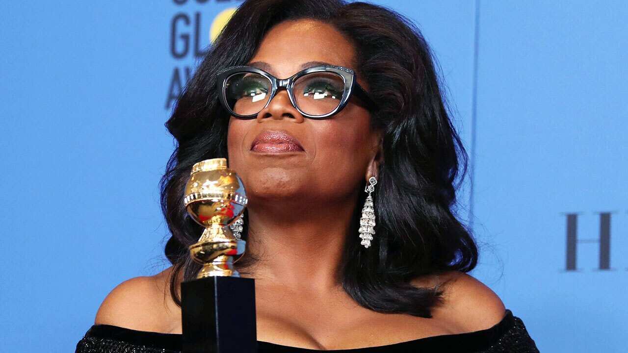 Oprah Winfrey holds the 2018 Golden Globe Cecil B. DeMille Award in the press room during the 75th annual Golden Globe Awards 