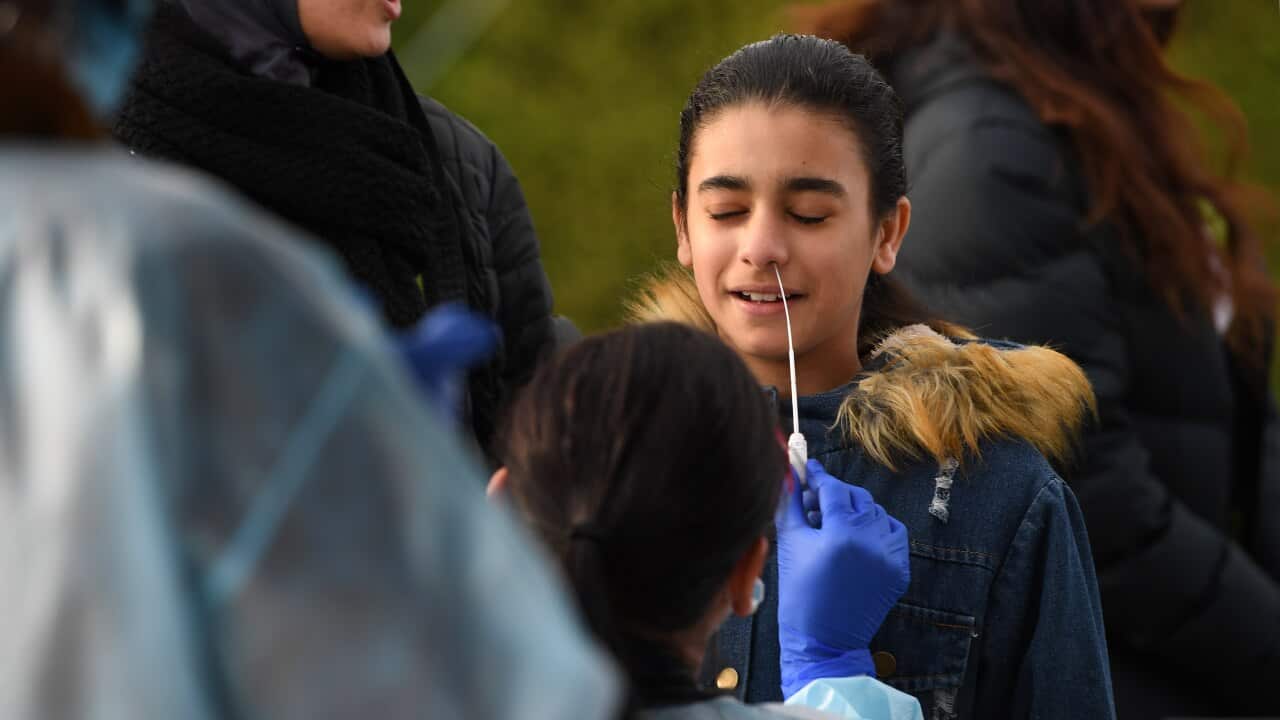 A person receives a COVID-19 test at a Coronavirus pop-up testing facility in Broadmeadows, Melbourne.