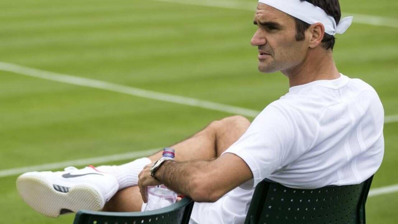 Roger Federer takes it all in at Wimbledon.