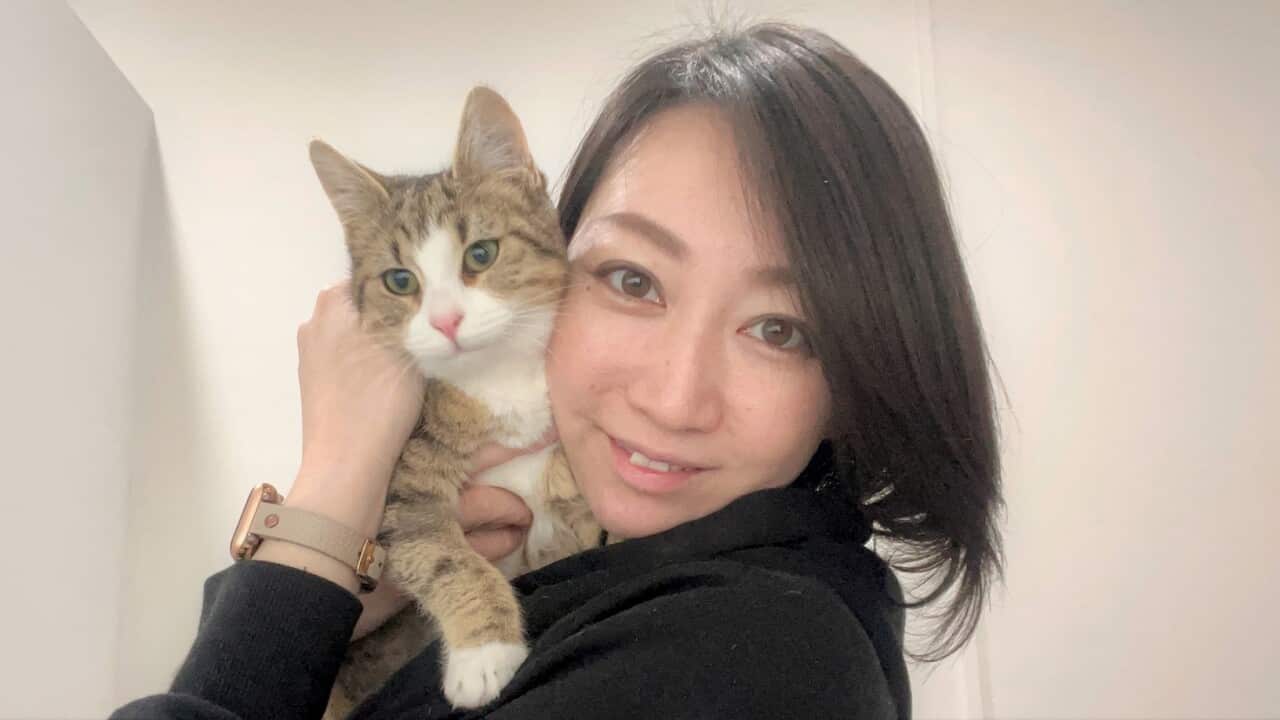 Cafe owner Yuki with Cotton (SBS-Sandra Fulloon).jpg