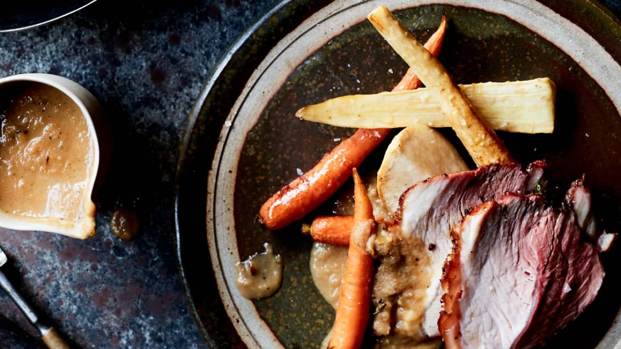 Slow-roasted pork shoulder with root vegetables and apple jus