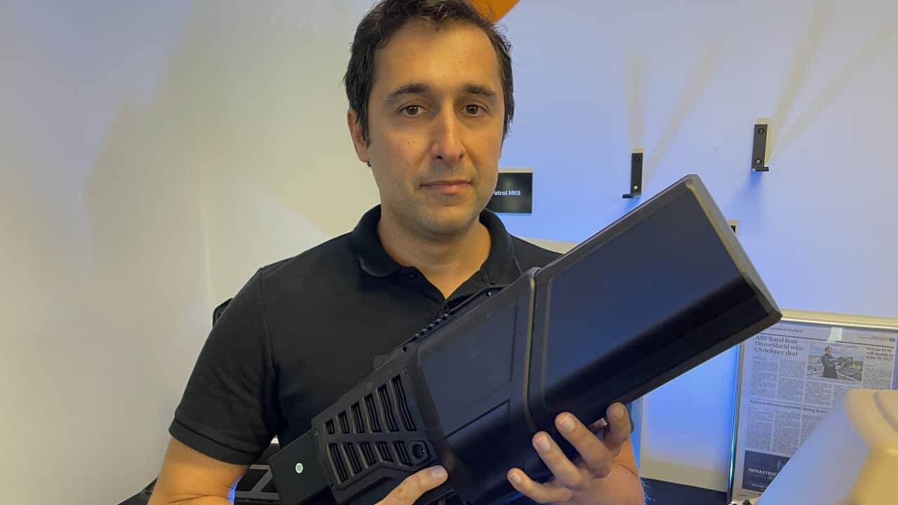 DroneShield CEO Oleg Vornik holds a counter drone device (SBS - Sandra Fulloon).jpg