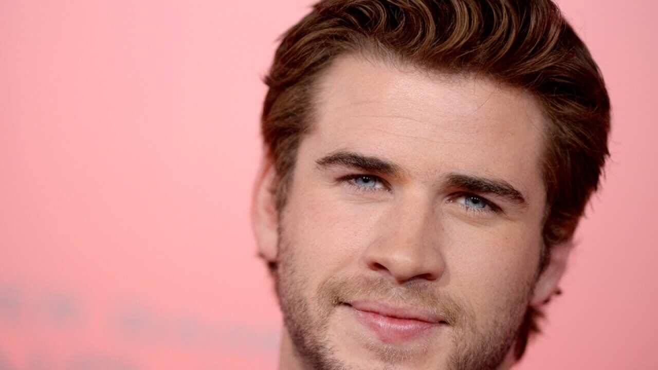 Liam Hemsworth attends a film premiere.