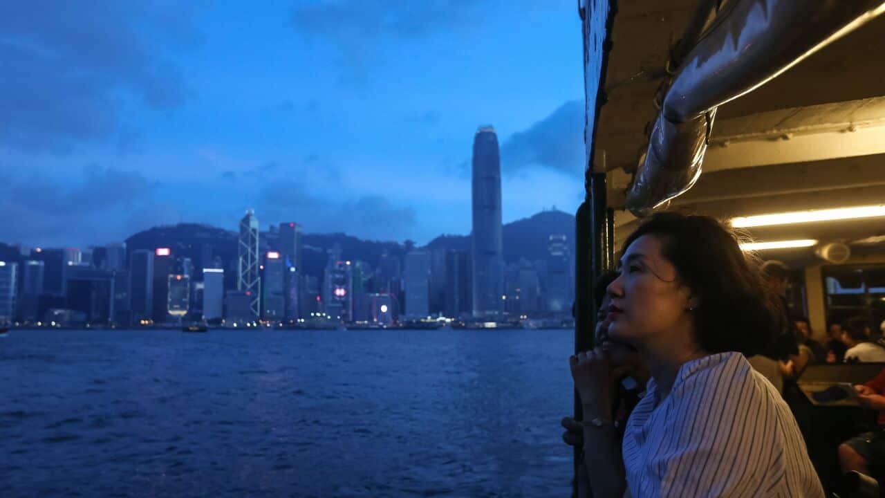 A woman looks out from the Star Ferry as the city's business district skyline is seen in the background in Hong Kong on June 3, 2018. (Photo by VIVEK PRAKASH / AFP) (Photo credit should read VIVEK PRAKASH/AFP/Getty Images)