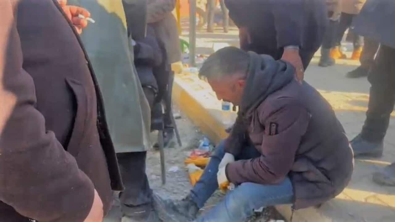 Man mourns his brother in Semsur turkey.jpeg