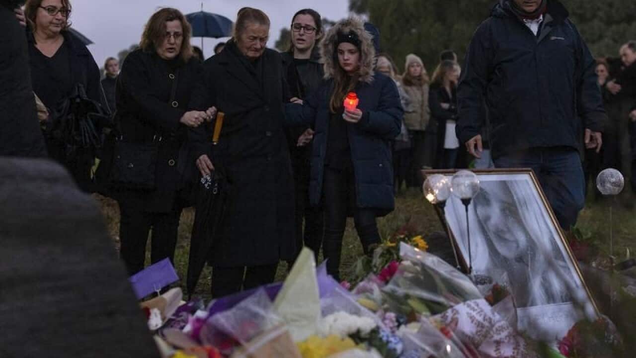 Mourners gather for the Vigil for Courtney Herron.