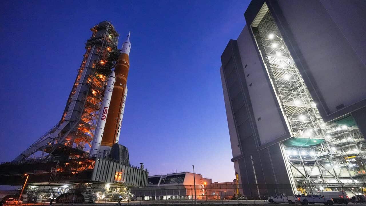 NASA's Artemis II SLS (Space Launch System) moon rocket with the Orion spacecraft slowly rolls back towards the Vehicle Assembly Building at the Kennedy Space Center, Wednesday, Feb. 25, 2026, in