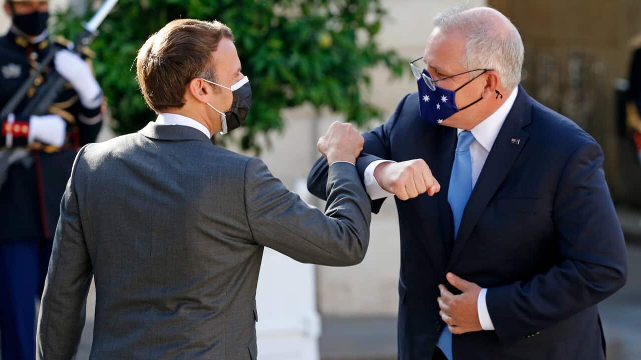 French President Emmanuel Macron (L) welcomes Australian Prime Minister, Scott Morrison (R)