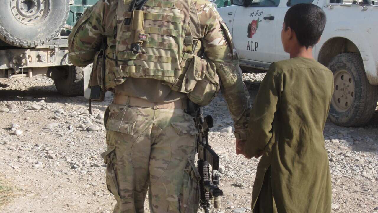 American soldier with Afghan child. (Image: Karen Middleton)