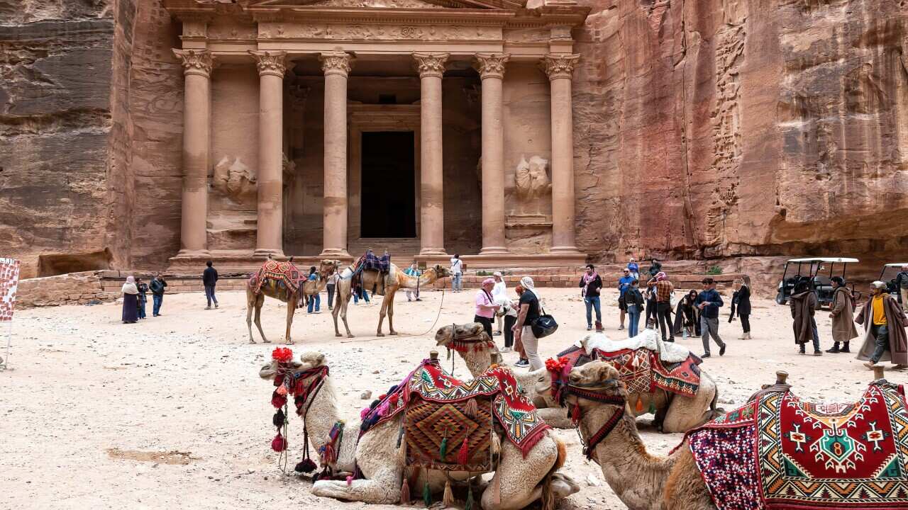 Camels seen in front of The Treasury in Petra, a famous