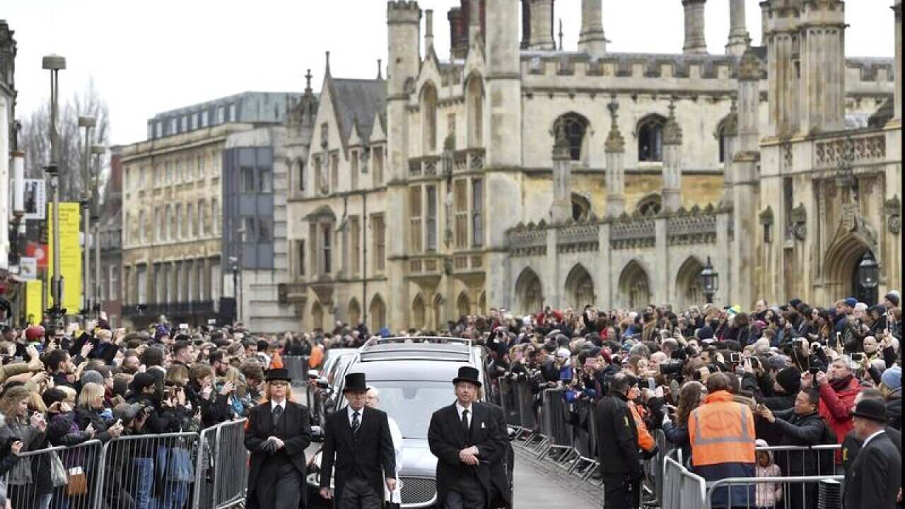 The hearse with Stephen Hawking's remains arrive at the church