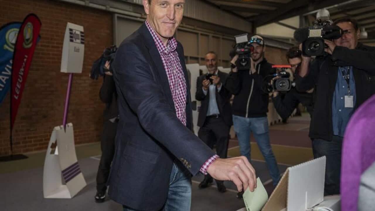 Labor candidate for Fremantle Josh Wilson casts his vote.