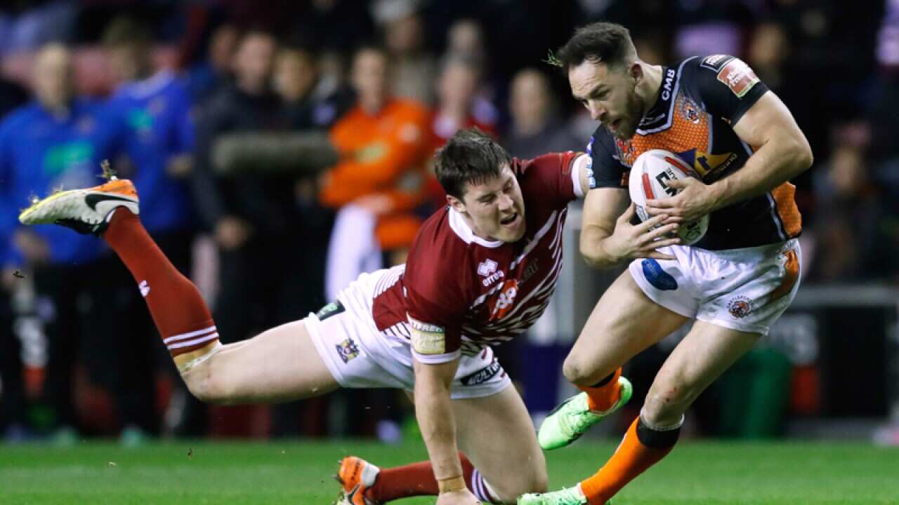 Wigan Warriors' Joel Tomkins tackles Castleford Tigers' Luke Gale