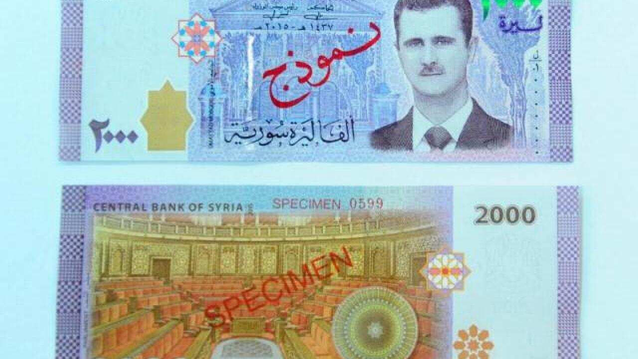A portrait of Syria's President Bashar al-Assad is seen printed on the new Syrian 2,000-pound banknote that has gone into circulation.