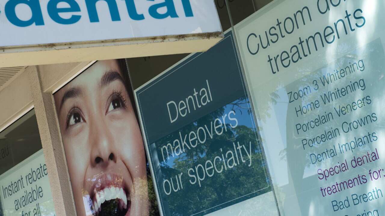 Stock image of advertising on the outside of a dental practice