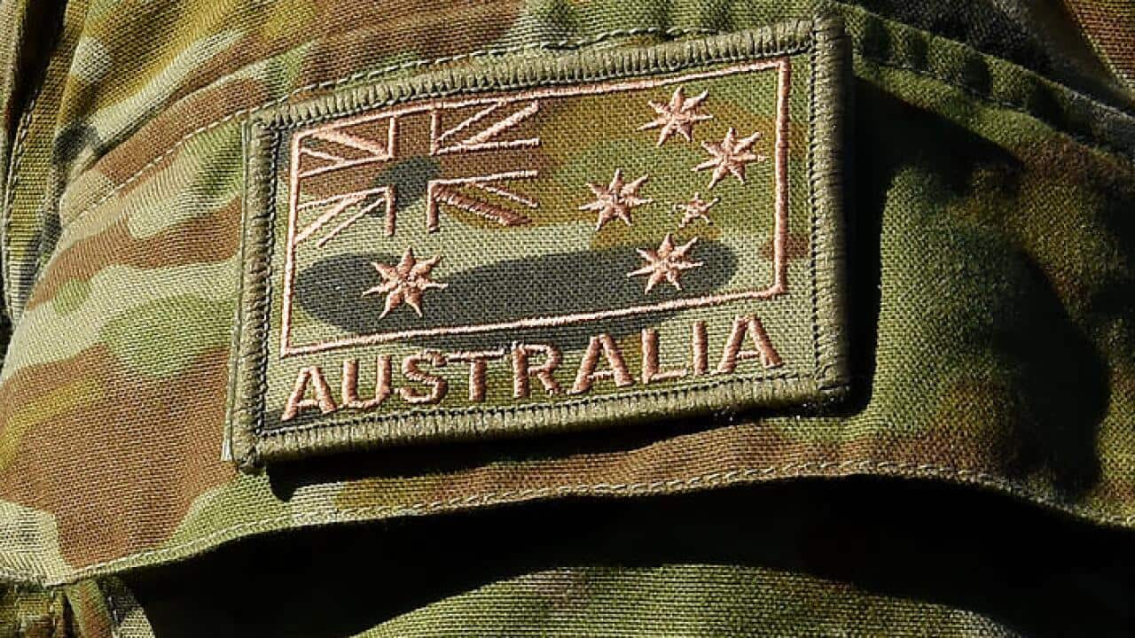 The Australian flag is seen on an Australian Defence Force (ADF) uniform at the Gallipoli Barracks in Brisbane, Tuesday, April 21, 2015.  (AAP Image/Dave Hunt) NO ARCHIVING