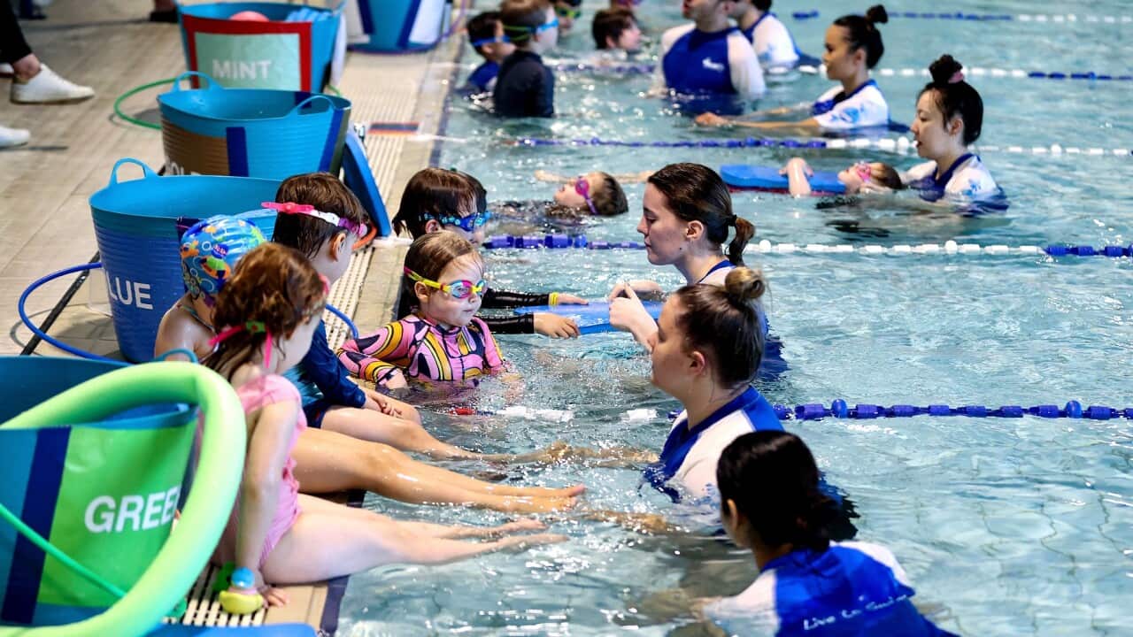 Kids participate in swimming lessons at the Lane Cove Aquatic Centre in Sydney (AAP)