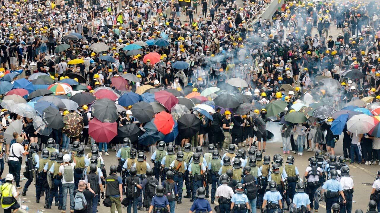 Protesters opposing a controversial extradition bill clash with riot police near Hong Kong's legislature building on 12 June, 2019.