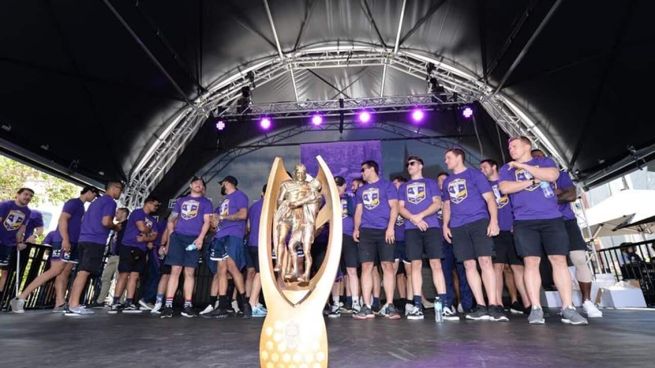 Storm players and the NRL premiership trophy