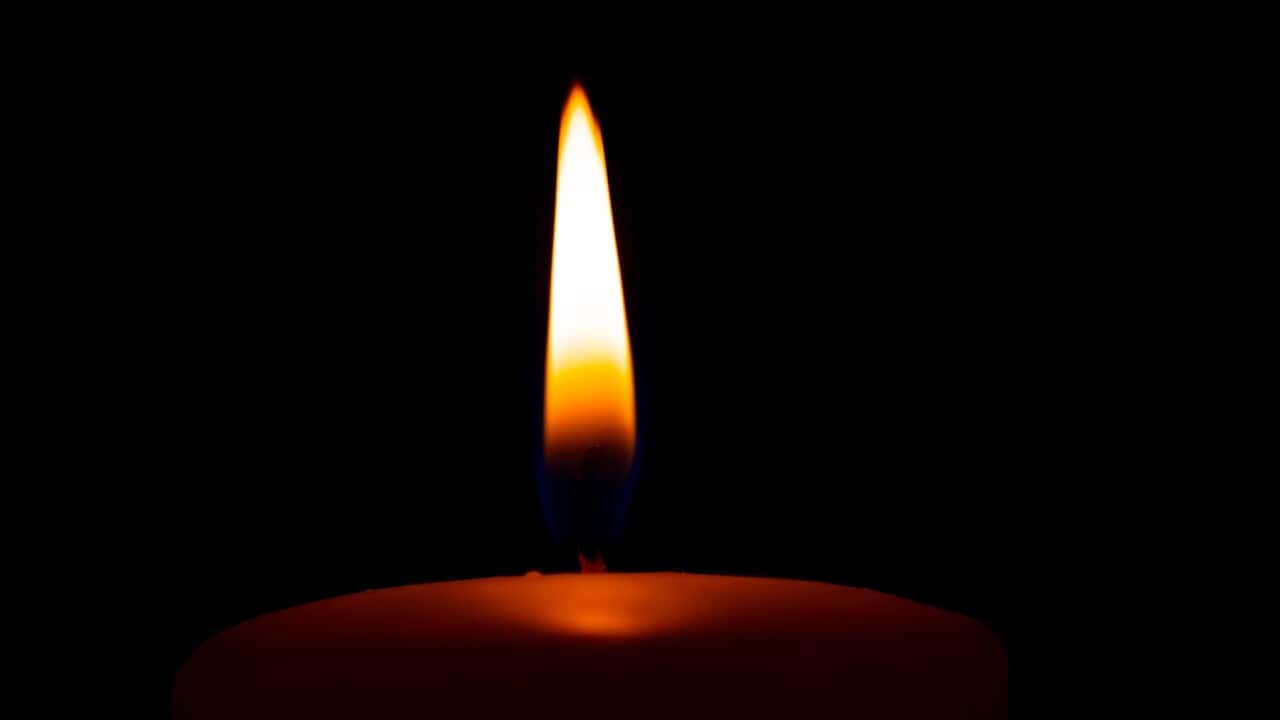 Candle flame in darkness