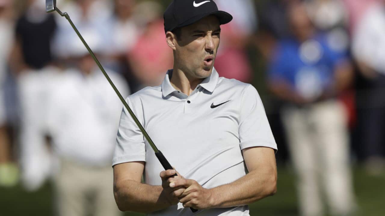 Britain's Ross Fisher reacts