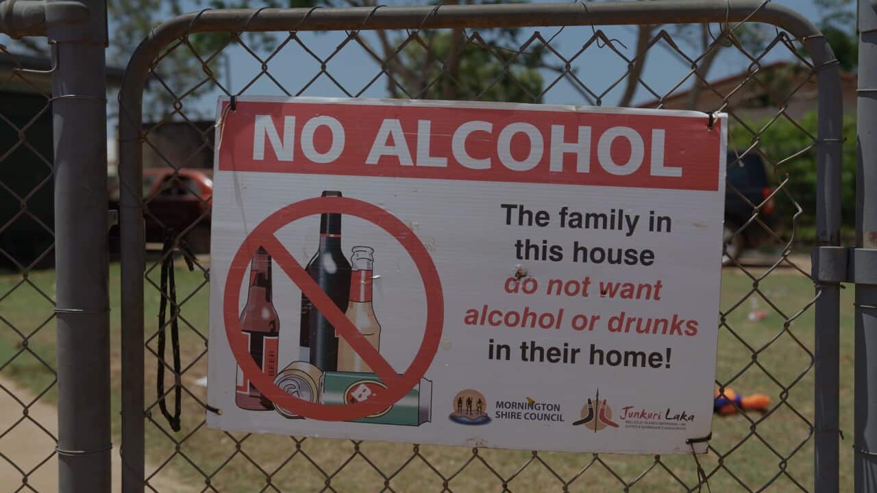 A sign on the front of a house that reads 'the family in this house do not want alcohol or drunks in their home'