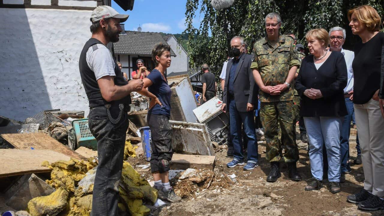 German Chancellor Angela Merkel and Rhineland-Palatinate State Premier Malu Dreyertalk inspect the damage after heavy flooding of the river Ahr.