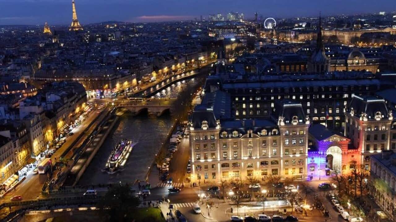 Arial photograph of Paris by night.