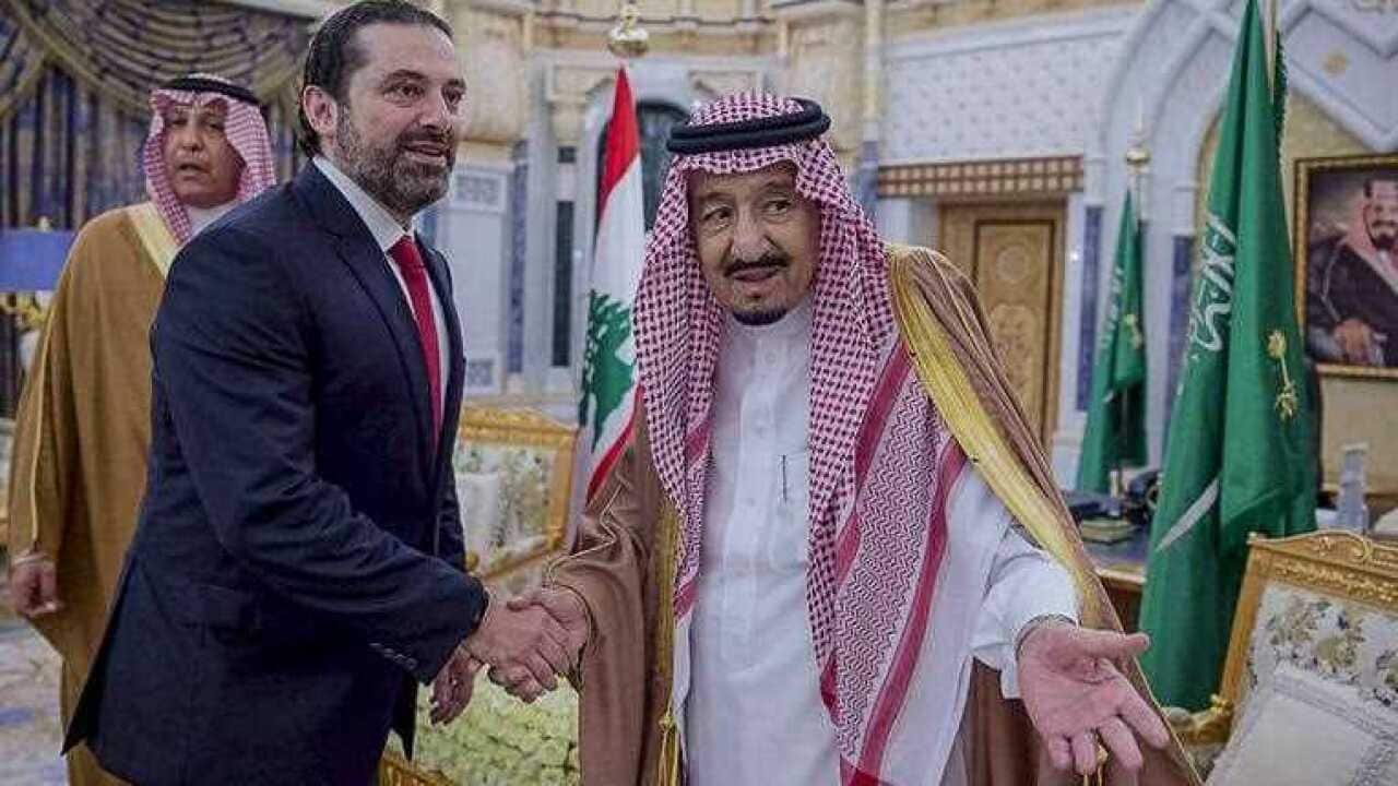 audi Arabia's King Salman bin Abdul-Aziz Al Saud (R) as he welcomes Lebanese Prime Minister Saad al-Hariri (L)