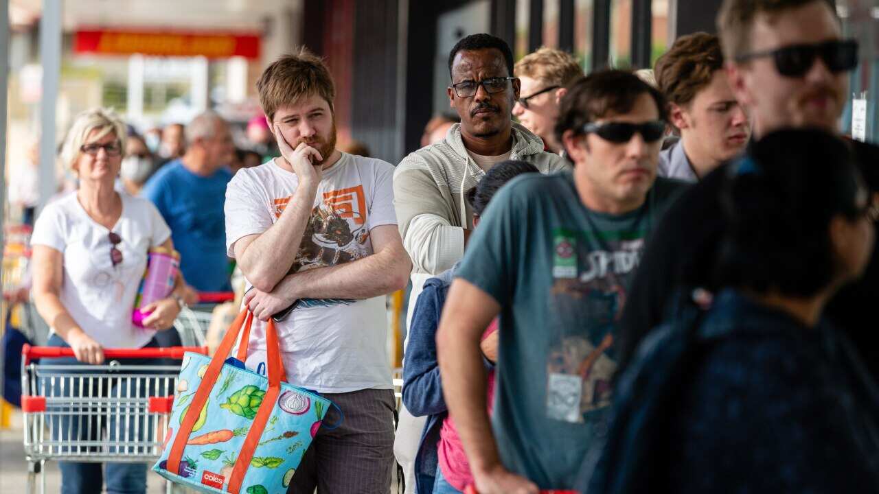 Shoppers are seen queuing at Coles Maylands in Perth as health authorities announced a snap three-day lockdown.