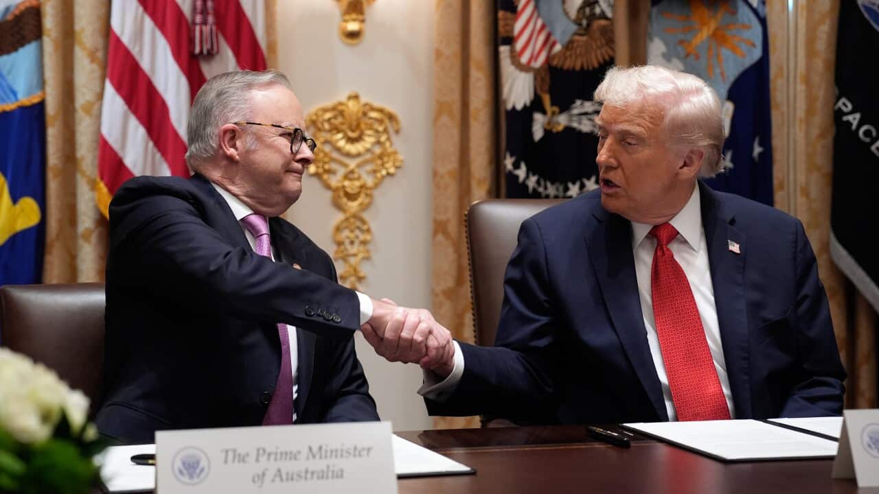 Donald Trump with Anthony Albanese shake hands.