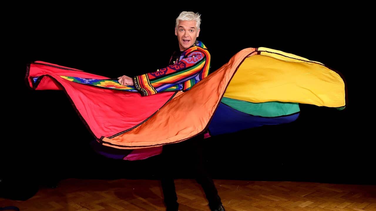 File photo from 2016 of Phillip Schofield modelling his old technicolour dreamcoat at the Music Rooms in New Cross Gate, London.
