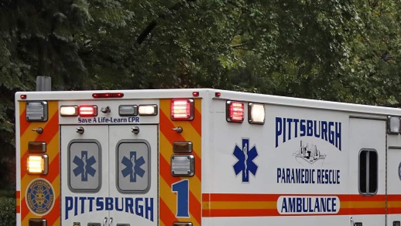 An ambulance arrives at the Tree of Life Synagogue where a shooter opened fire Saturday, Oct. 27, 2018, injuring multiple people, including three police officers.(AP Photo/Gene J. Puskar)