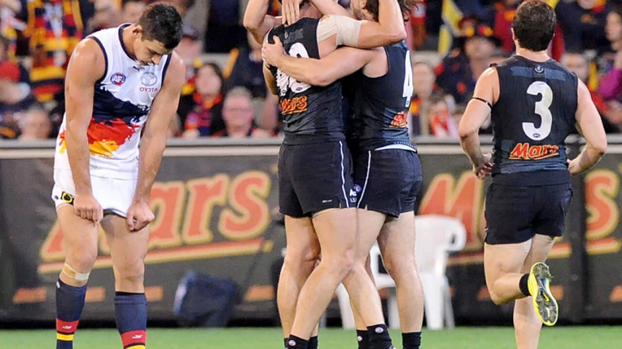 Carlton players cerebrate victory over Adelaide