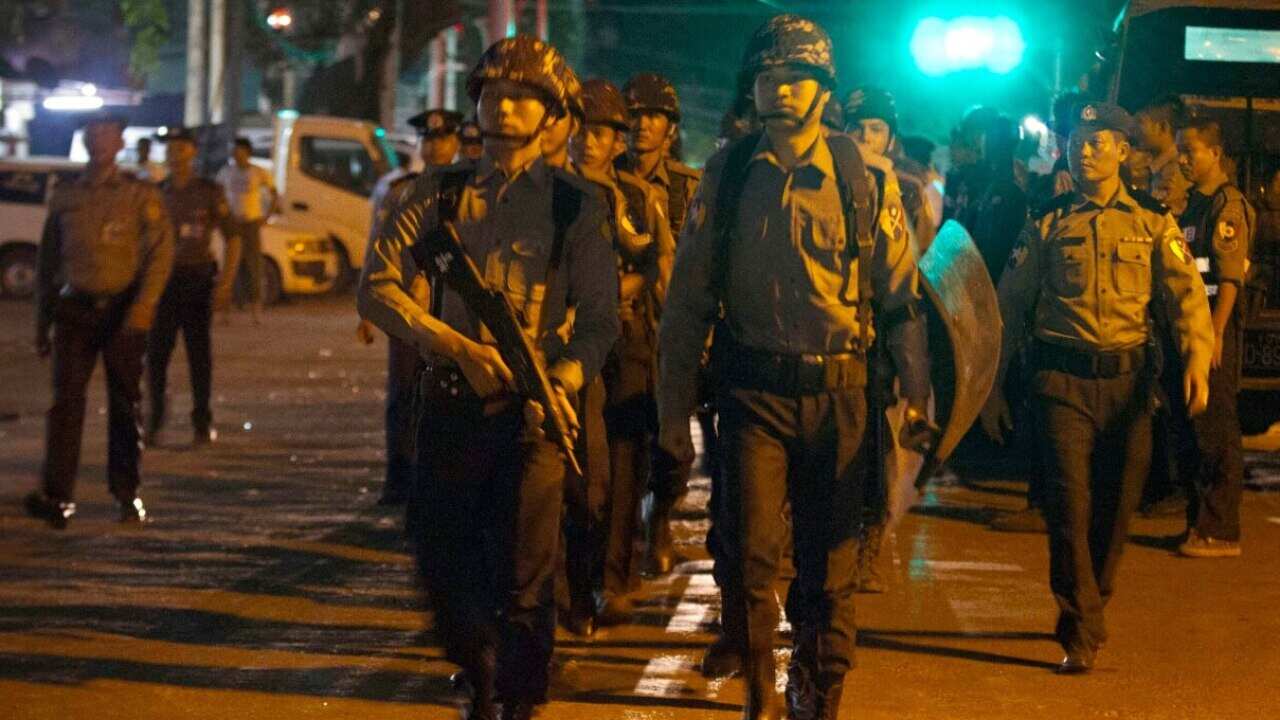 In this Tuesday, May 9, 2017 photo, Myanmar riot police patrol to provide security on a road in Mingala Taungnyunt township where Buddhist hard-liners