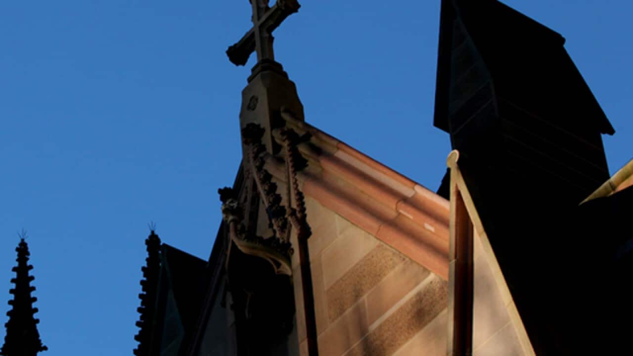 A cross on the exterior of a church