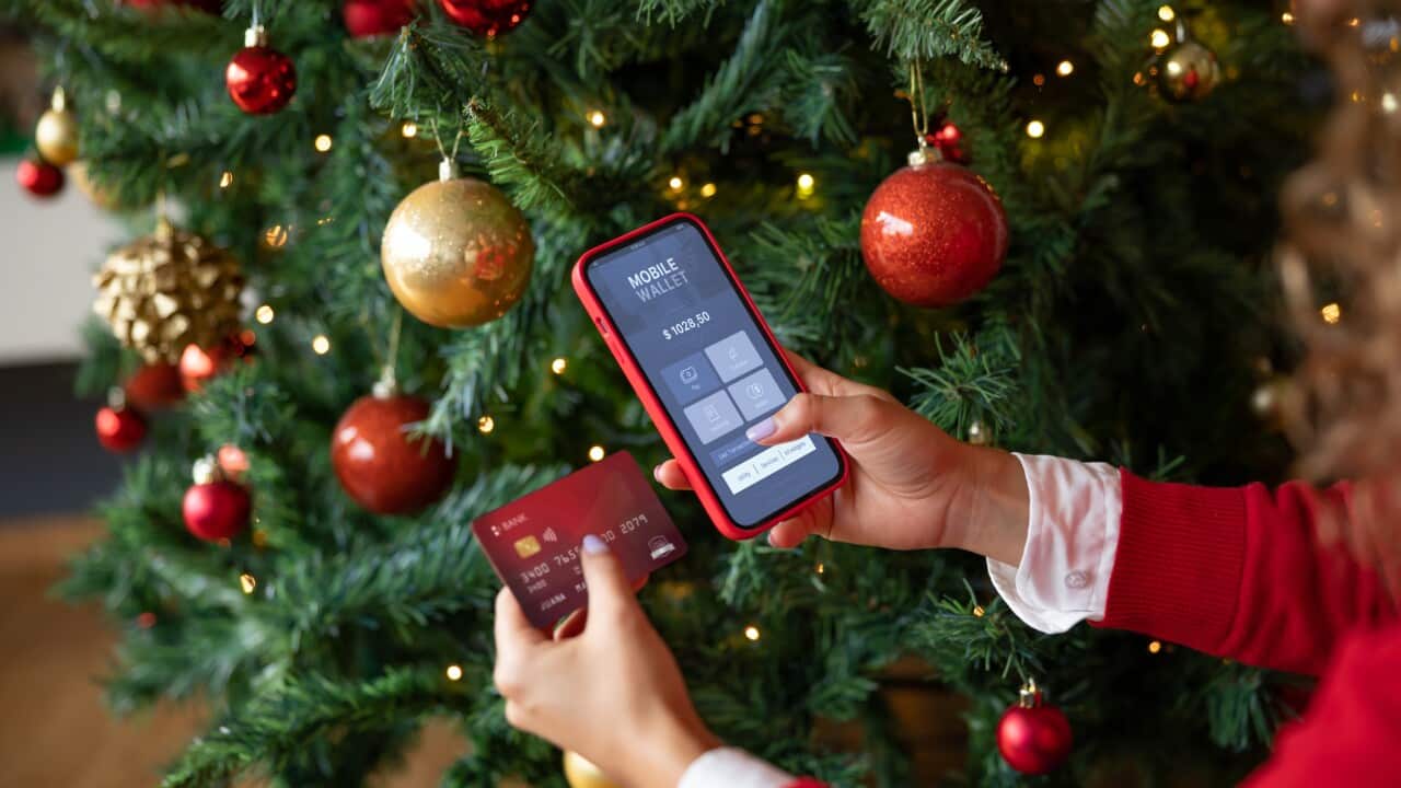 Woman buying Christmas presents online