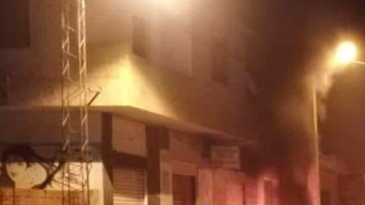 Tunisian Police officers patrol after clashes in the streets of Kasserine, southern of Tunisia, Tuesday, Dec 25, 2018 (AAP)